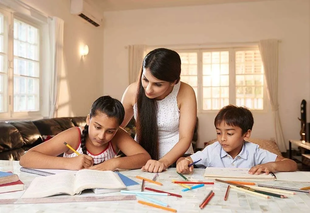 Home tutor guiding students through a lesson