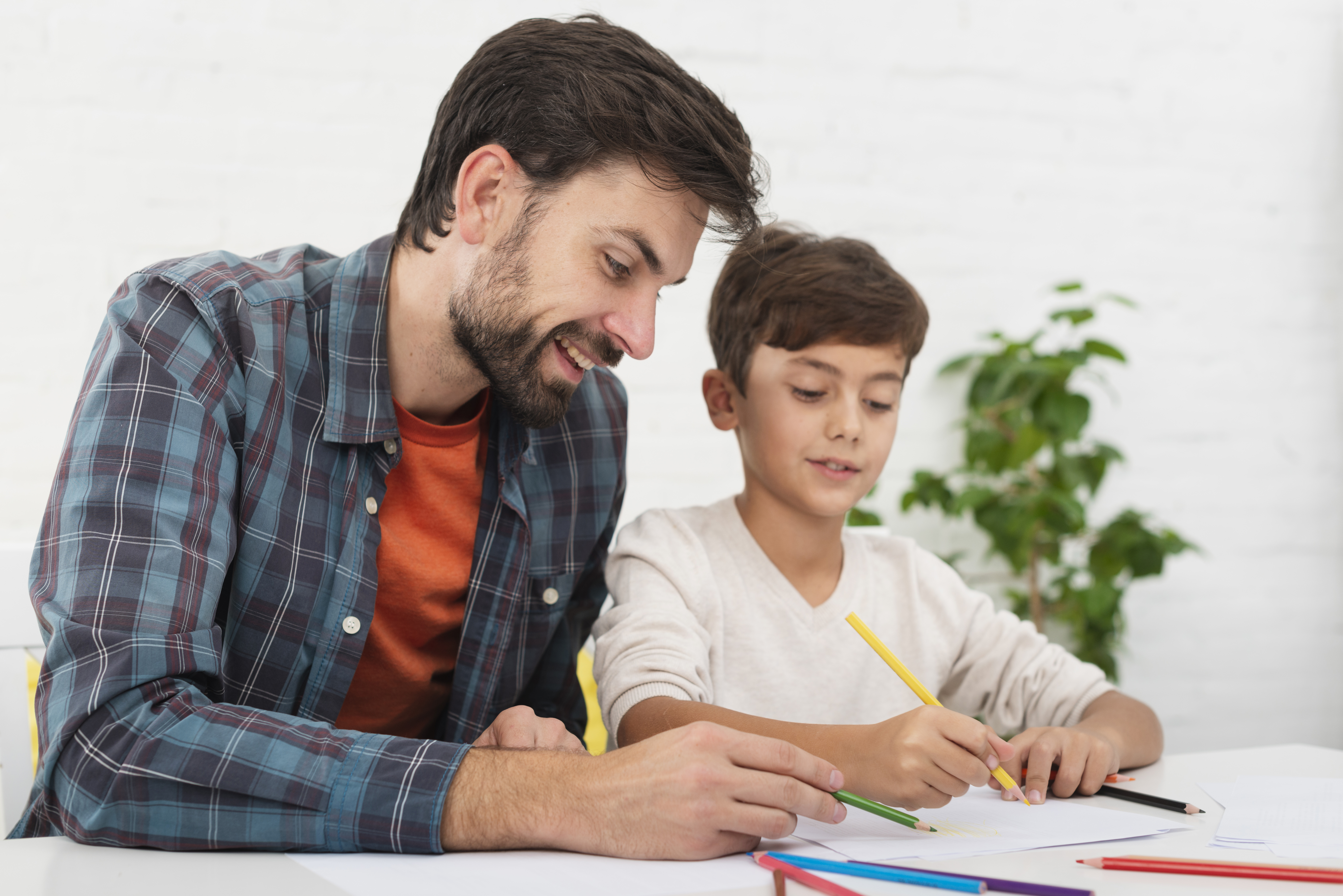 Tutor session with notebook and laptop